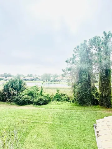 a view of a garden with a lake view