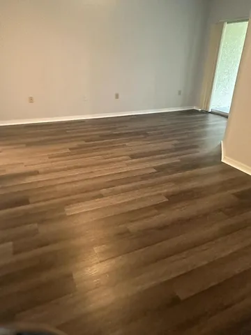 a bath room with a toilet and a bath tub