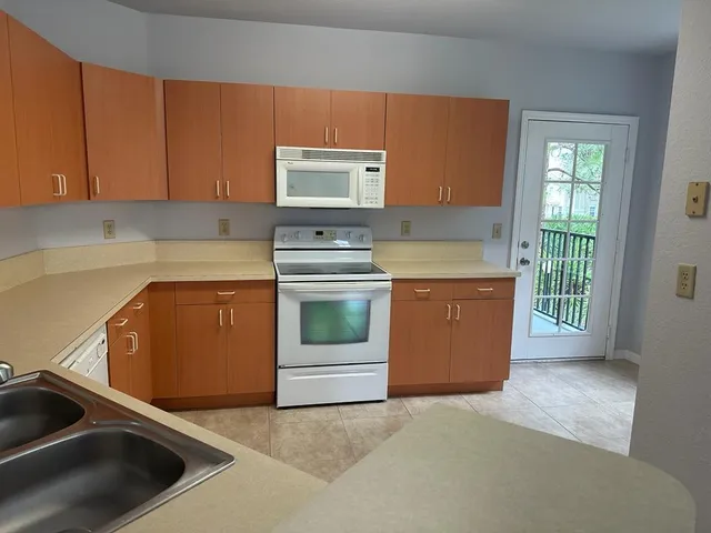 a kitchen with a stove and a sink
