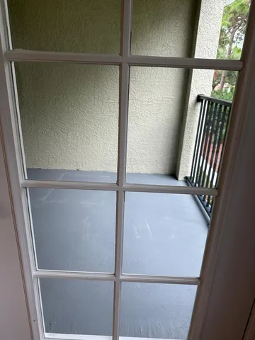 a view of a closet with wooden floor
