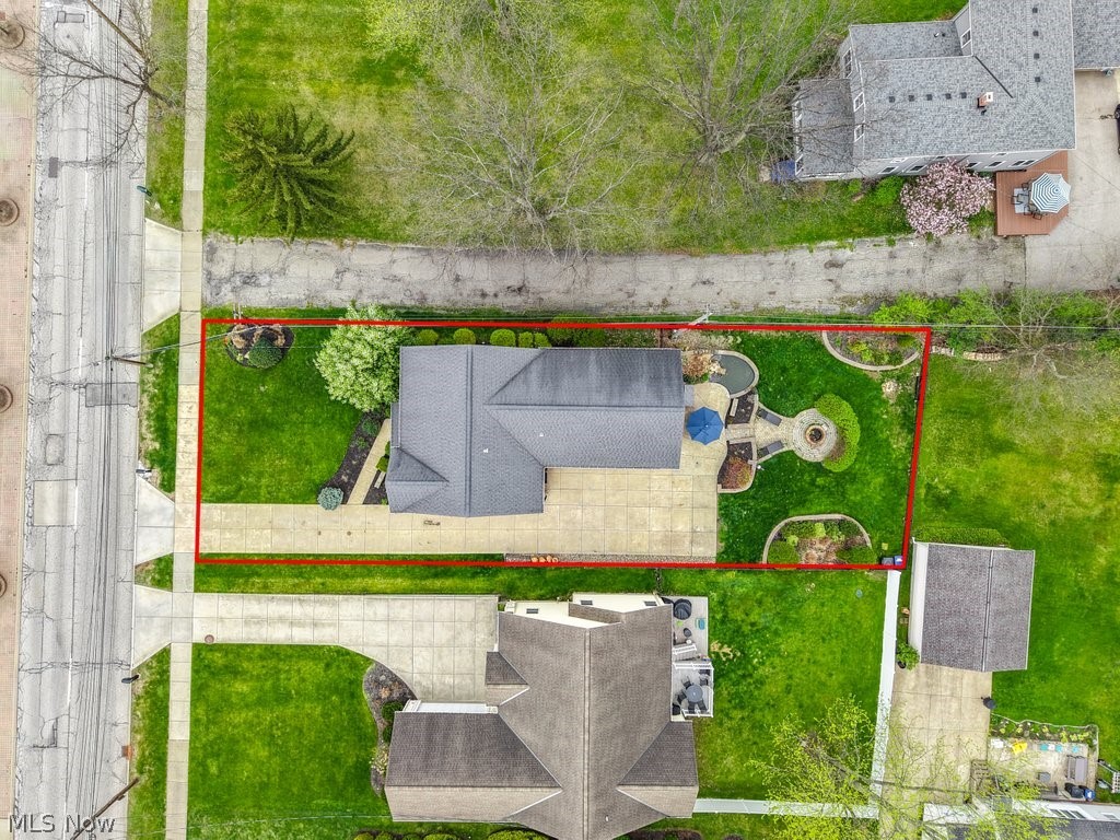 6325 Brecksville Road Independence, OH 44131 - Photo 3 of 50 An aerial view of the property showcasing a well-maintained lawn and a paved driveway leading to the residence