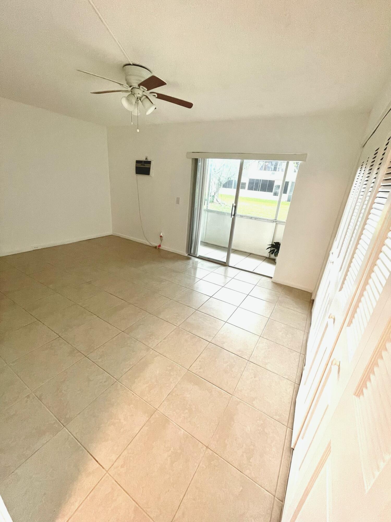 128 Canterbury F, Unit 128 West Palm Beach, FL 33417 - Photo 3 of 17 a view of a room with a window