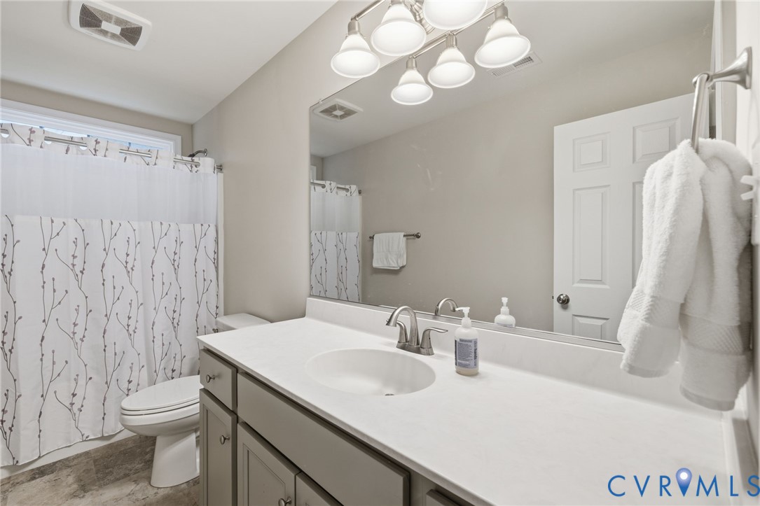 4001 Bircham Loop Midlothian, VA 23113 - Photo 30 of 33 a bathroom with a sink vanity mirror and toilet