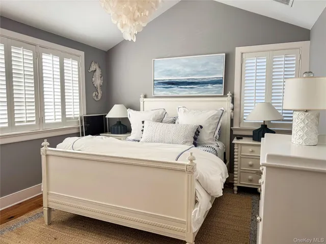 a bedroom with a bed and a night stand