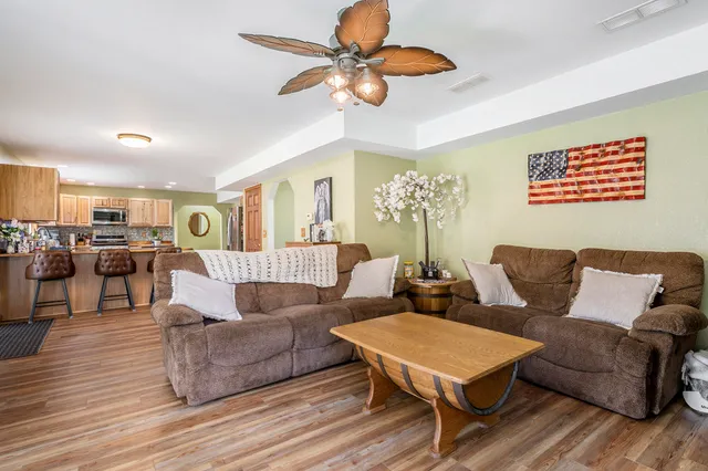 a living room with furniture and a table