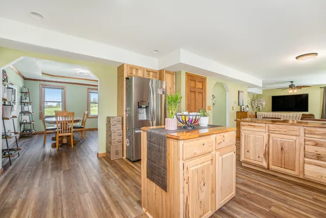 a open kitchen with sink cabinets and wooden floor