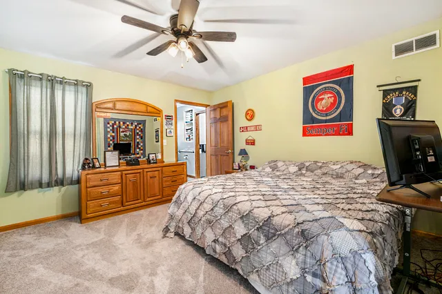 a bed room with a bed and a chandelier