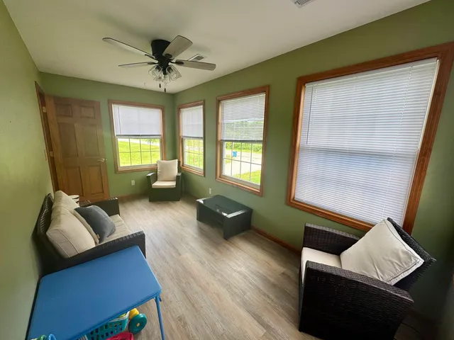 a living room with furniture and a window