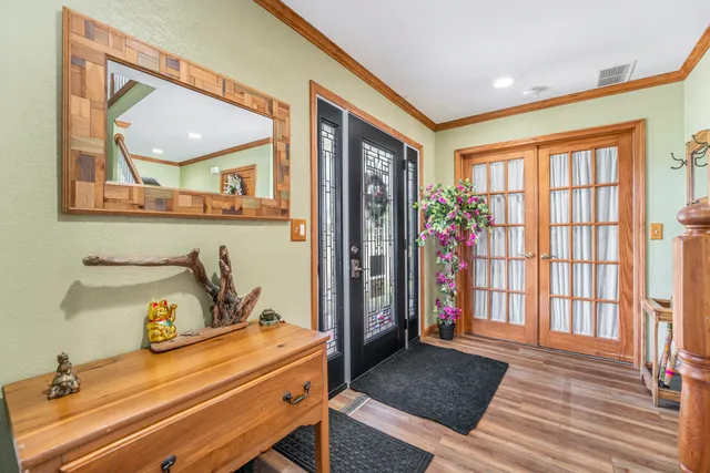 a bedroom with furniture and a window