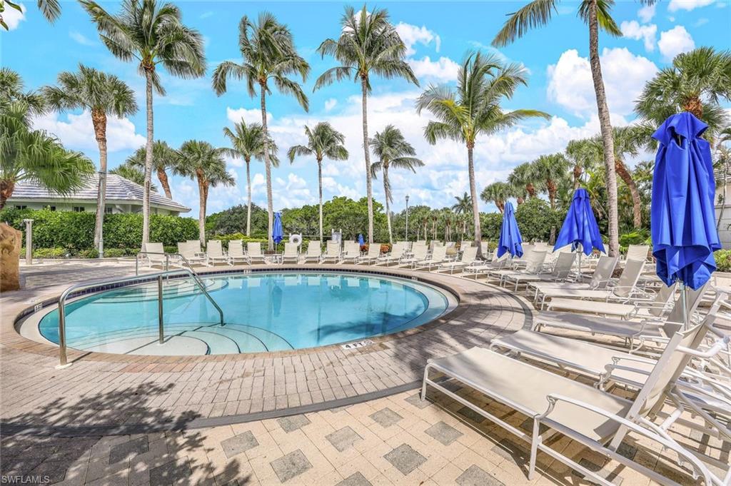 15495 Rio Ponace Court Naples, FL 34114 - Photo 40 of 43 Community pool featuring a patio