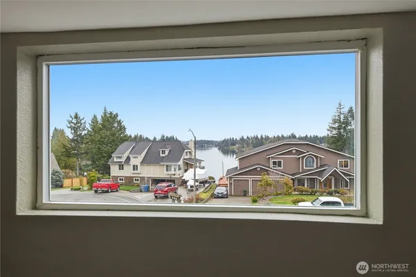 a kitchen with granite countertop wooden cabinets stainless steel appliances and a counter space