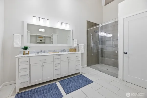 a bedroom with a bed and a view of bathroom