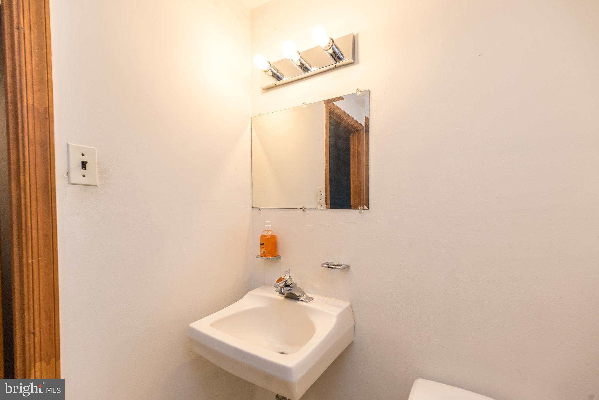 35 Fox Hill Road Doylestown, PA 18901 - Photo 34 of 49 a bathroom with a sink and a mirror
