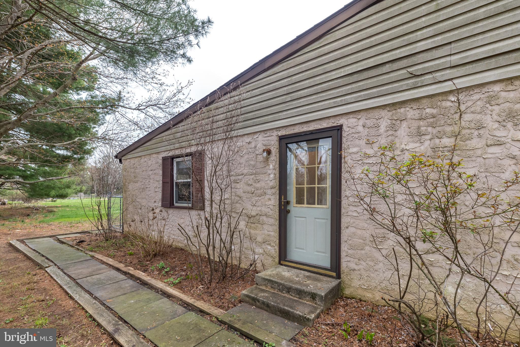 35 Fox Hill Road Doylestown, PA 18901 - Photo 42 of 49 a front view of a house with garden
