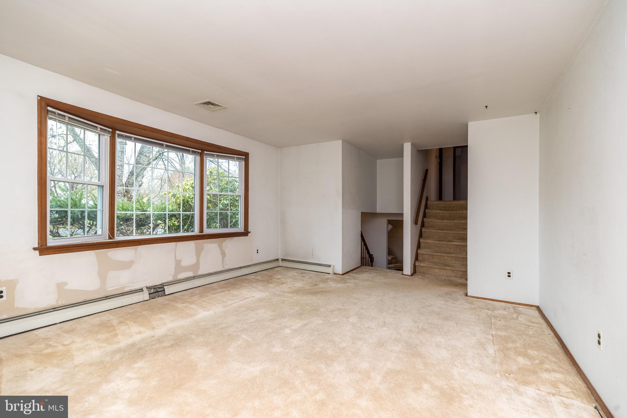 35 Fox Hill Road Doylestown, PA 18901 - Photo 6 of 49 an empty room with a natural light