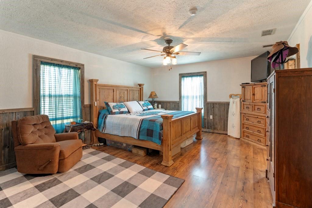 10276 Timber Trail Scurry, TX 75158 - Photo 22 of 40 a bedroom with a bed couch and a window