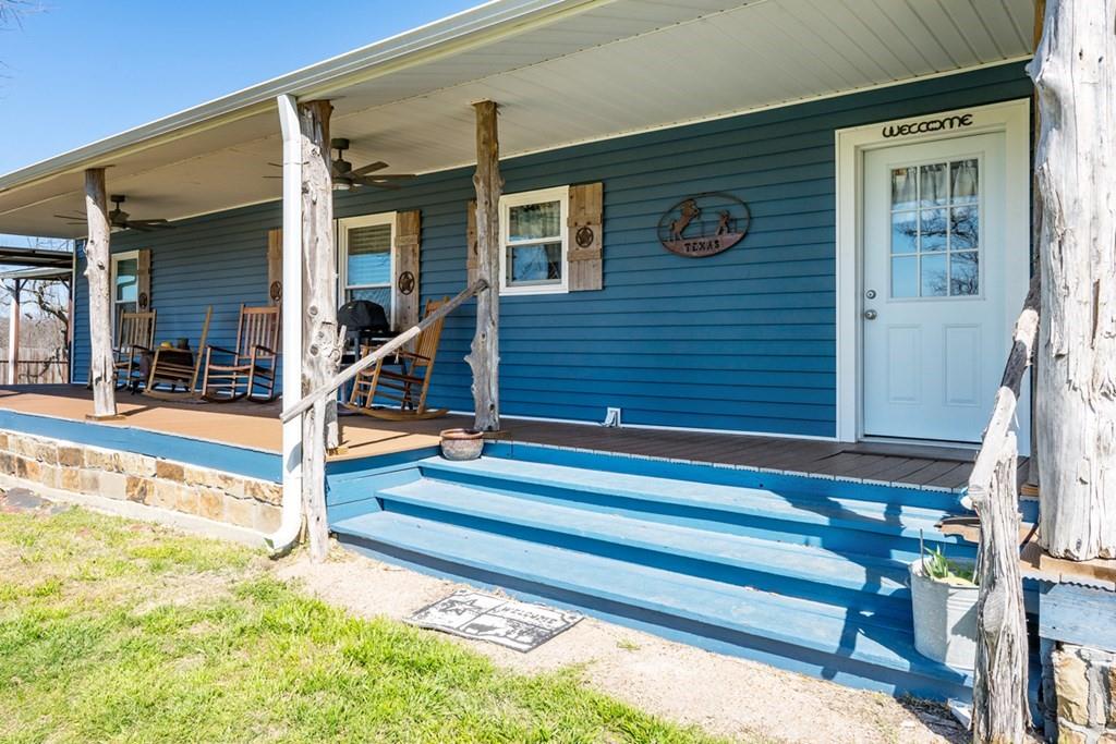 10276 Timber Trail Scurry, TX 75158 - Photo 32 of 40 a view of house with stairs and wooden fence