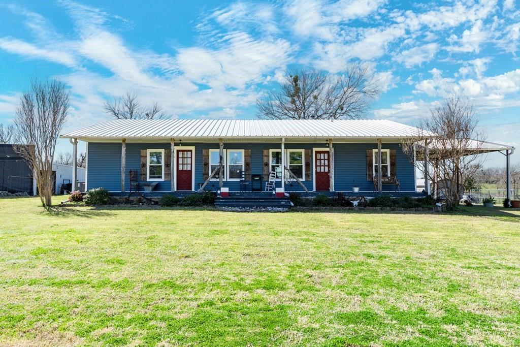 10276 Timber Trail Scurry, TX 75158 - Photo 4 of 40 a front view of house with yard and patio