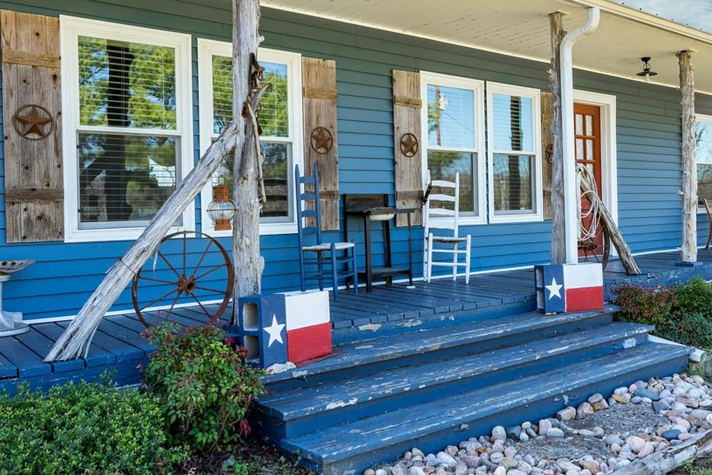 10276 Timber Trail Scurry, TX 75158 - Photo 6 of 40 a house view with a sitting space and garden