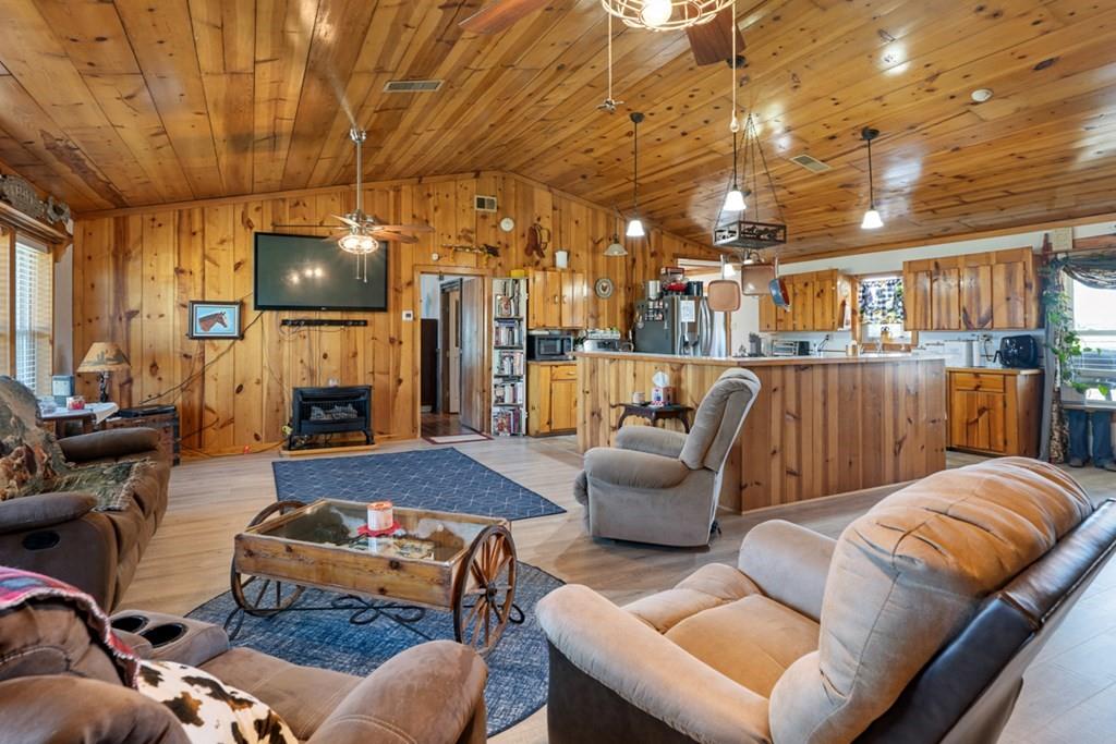 10276 Timber Trail Scurry, TX 75158 - Photo 8 of 40 a outdoor living space with furniture and a fireplace