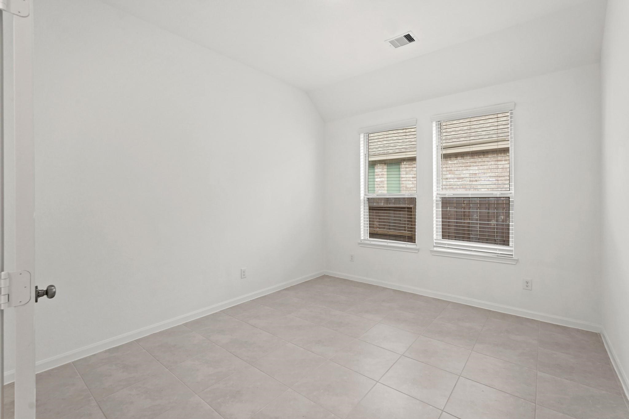 4915 Sierra Ridge Drive Rosenberg, TX 77469 - Photo 14 of 25 a view of an empty room with a window
