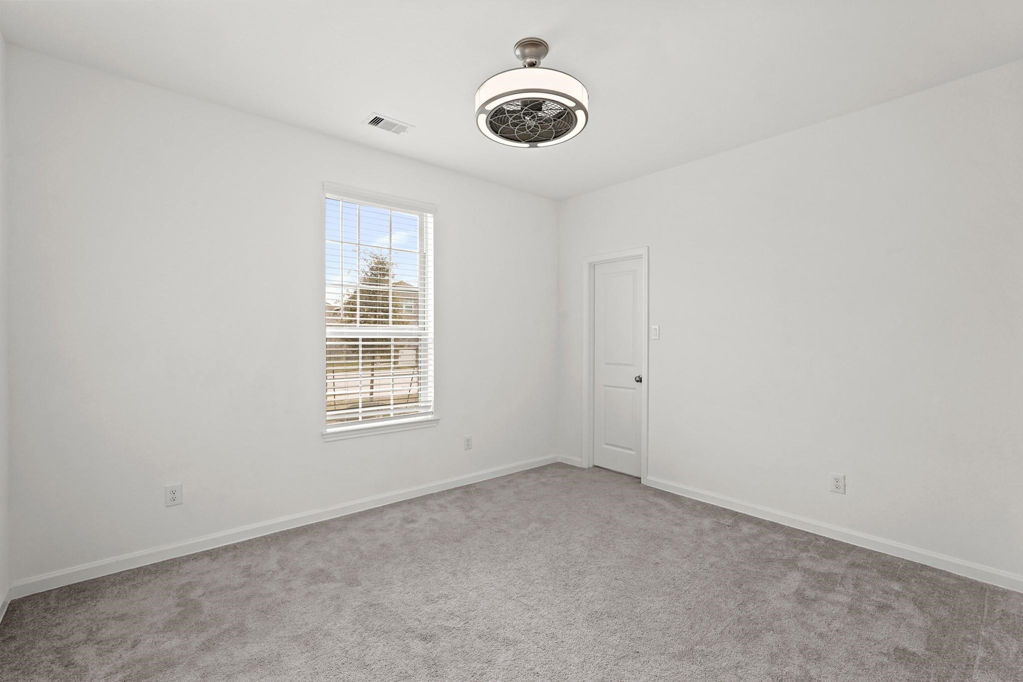 4915 Sierra Ridge Drive Rosenberg, TX 77469 - Photo 16 of 25 an empty room with windows