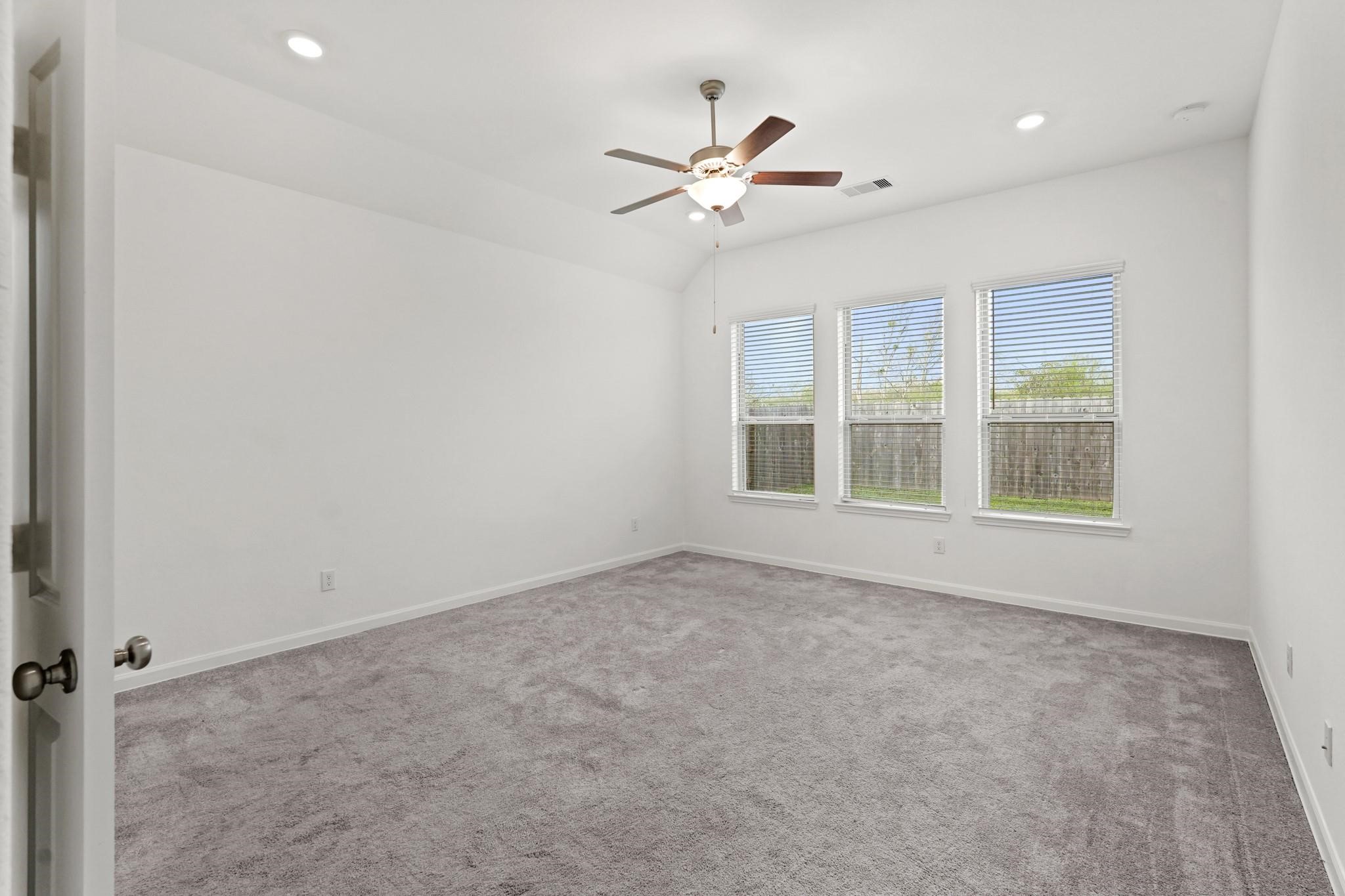 4915 Sierra Ridge Drive Rosenberg, TX 77469 - Photo 8 of 25 a view of an empty room with a window