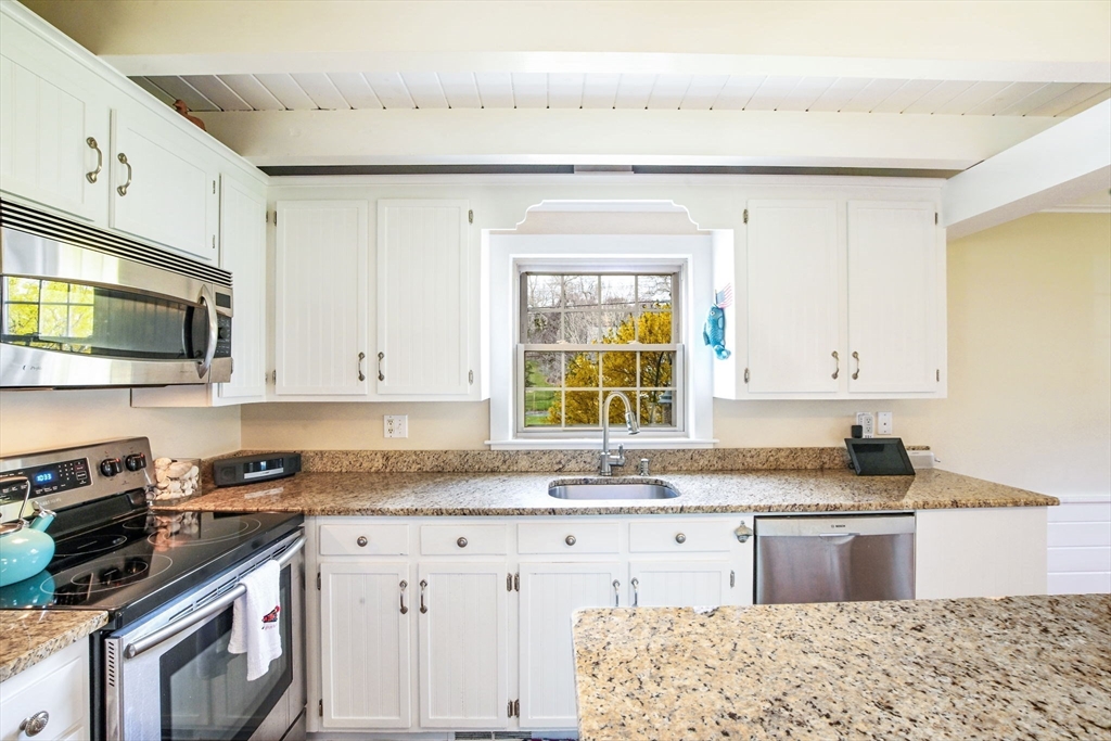 2 Jonathan Lane Sandwich, MA 02563 - Photo 11 of 38 a kitchen with granite countertop cabinets stainless steel appliances a sink and a window