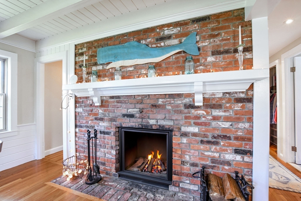 2 Jonathan Lane Sandwich, MA 02563 - Photo 15 of 38 a room with fireplace and a wooden floor