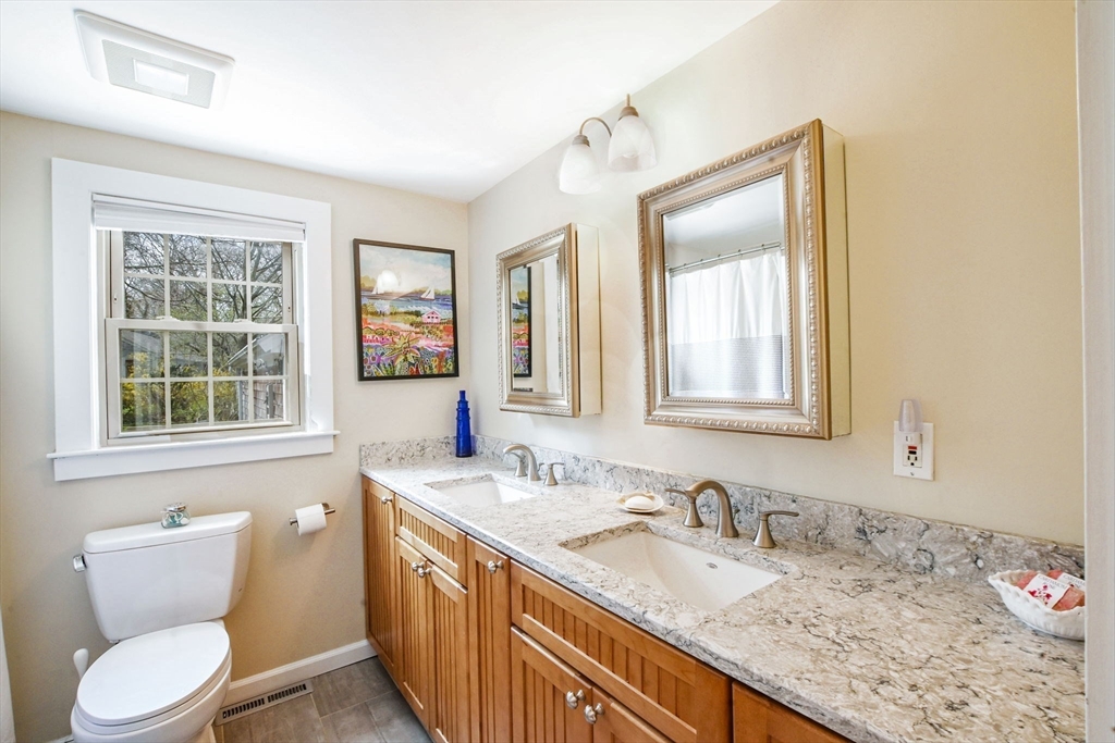 2 Jonathan Lane Sandwich, MA 02563 - Photo 20 of 38 a bathroom with a granite countertop sink mirror and a toilet