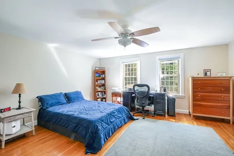 a bedroom with a bed and furniture