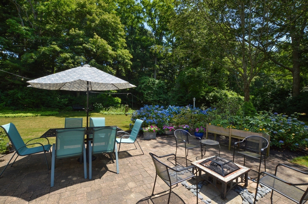 2 Jonathan Lane Sandwich, MA 02563 - Photo 26 of 38 a view of backyard with seating space and trees