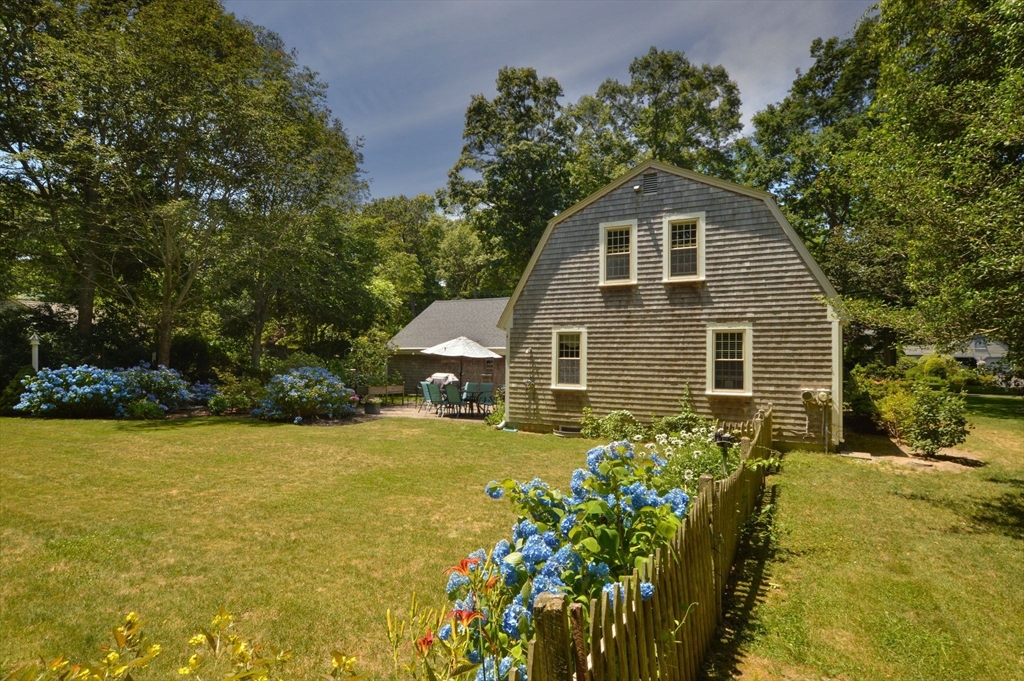 2 Jonathan Lane Sandwich, MA 02563 - Photo 32 of 38 a view of a house with backyard and garden