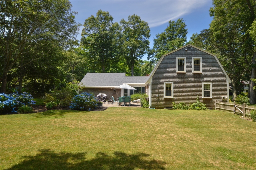 2 Jonathan Lane Sandwich, MA 02563 - Photo 33 of 38 a front view of a house with a yard and trees