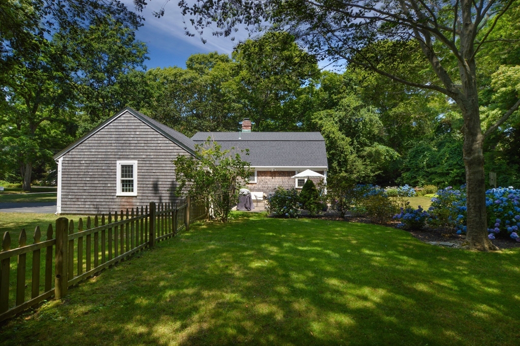 2 Jonathan Lane Sandwich, MA 02563 - Photo 34 of 38 a front view of a house with yard and green space