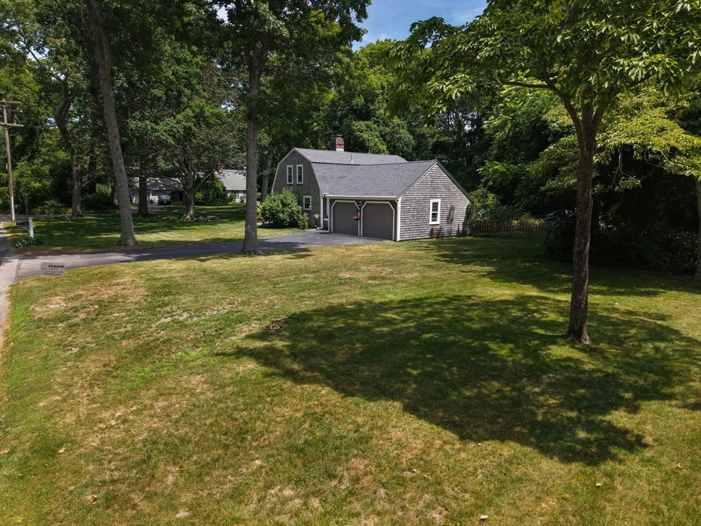 2 Jonathan Lane Sandwich, MA 02563 - Photo 36 of 38 a front view of house with yard and green space