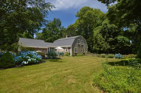 a front view of house with garden