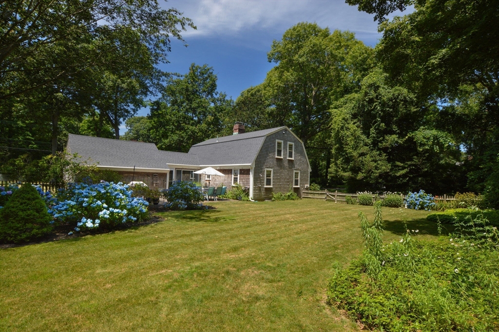 2 Jonathan Lane Sandwich, MA 02563 - Photo 6 of 38 a front view of house with garden