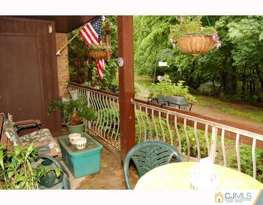 1919 Raspberry Court Edison, NJ 08817 - Photo 8 of 9 a view of a chairs and table in the balcony