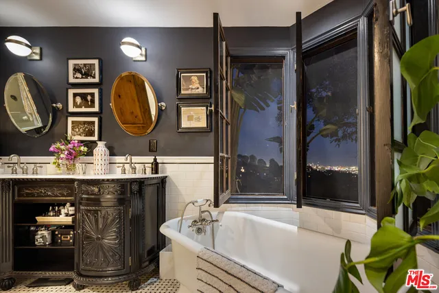 a spacious bathroom with a sink a toilet and shower