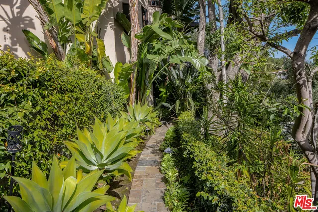 a view of hall way with furniture