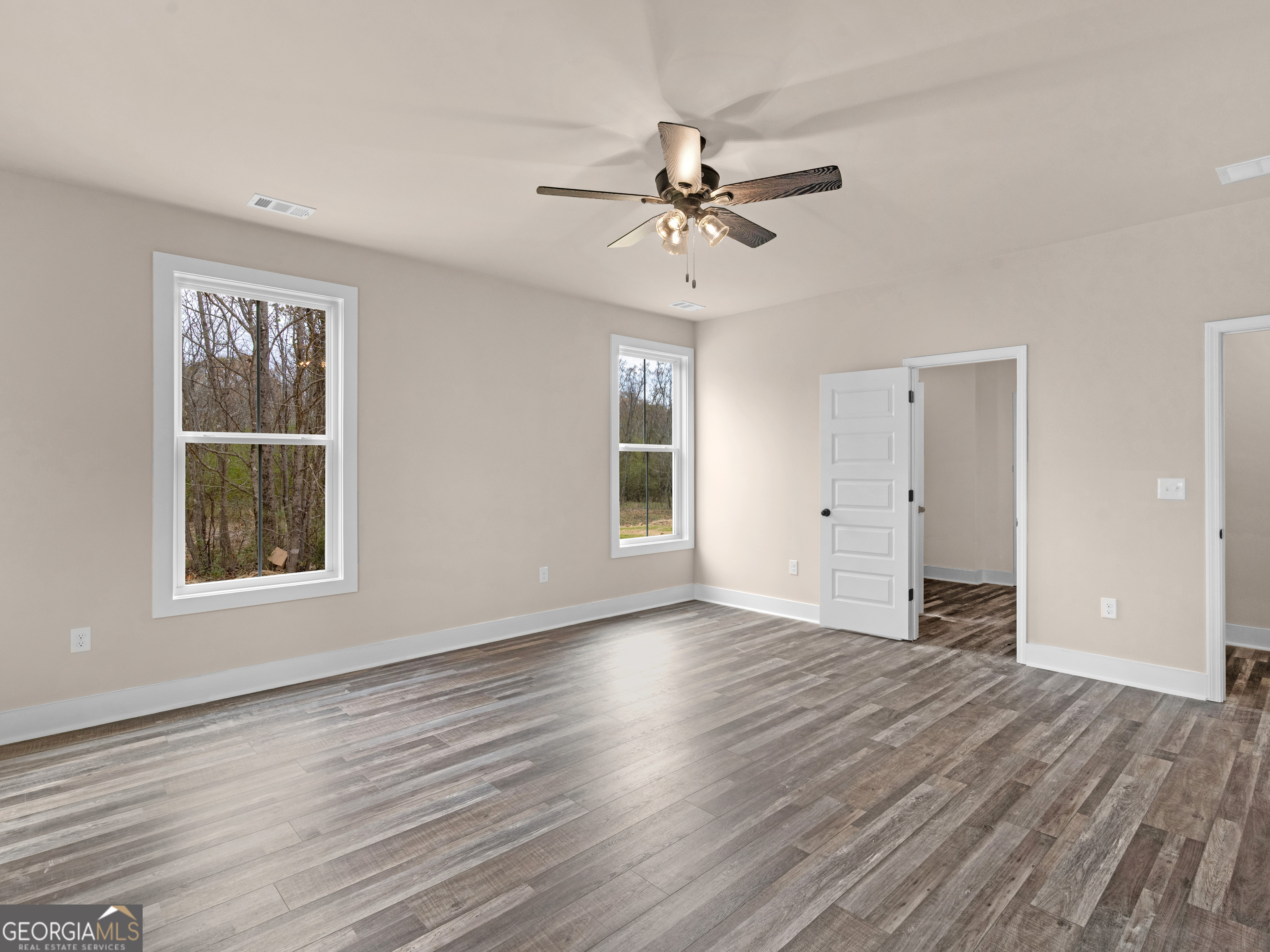 160 Loyd Road Mansfield, GA 30056 - Photo 44 of 53 a view of an empty room with wooden floor and a window