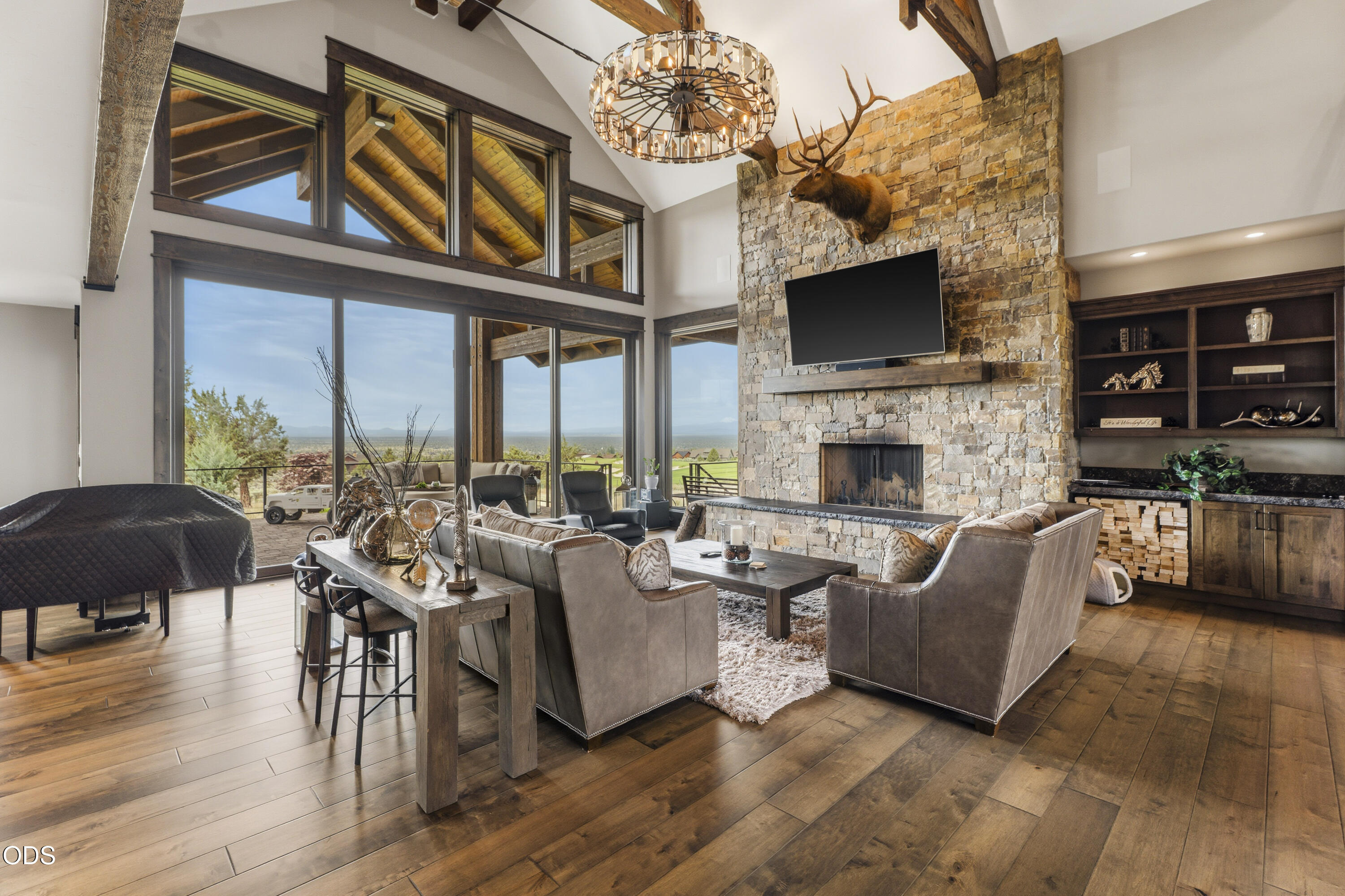 15935 South W Brasada Ranch Road Powell Butte, OR 97753 - Photo 5 of 45 a living room with fireplace furniture and a flat screen tv