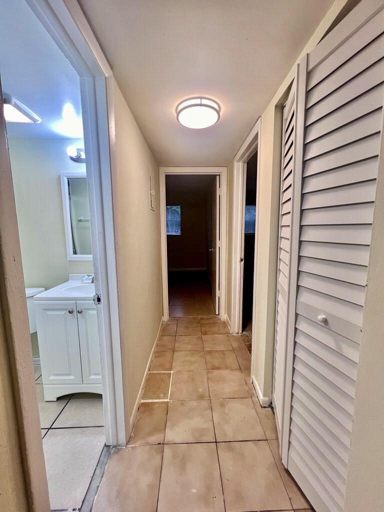 645 Southwest 20th Court, Unit 20 Delray Beach, FL 33445 - Photo 7 of 18 a view of a hallway