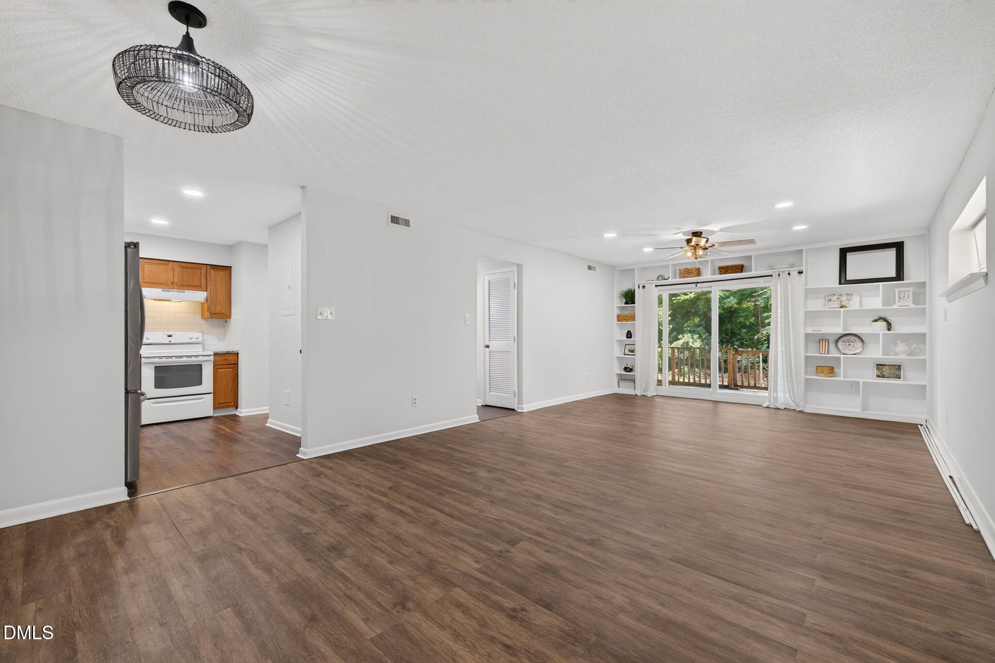 546 Pine Ridge Place Raleigh, NC 27609 - Photo 1 of 21 a view of an empty room with a window and wooden floor