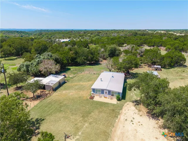 a aerial view of a house with a yard