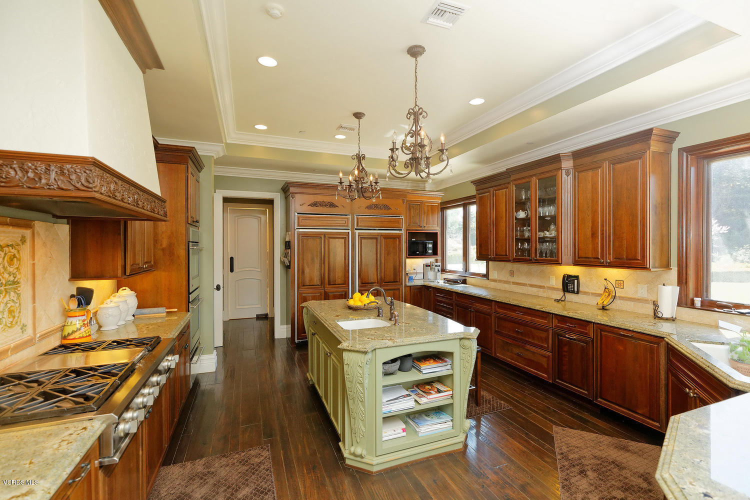 110 West Potrero Road Thousand Oaks, CA 91361 - Photo 13 of 33 a large kitchen with kitchen island a sink stainless steel appliances and a chandelier