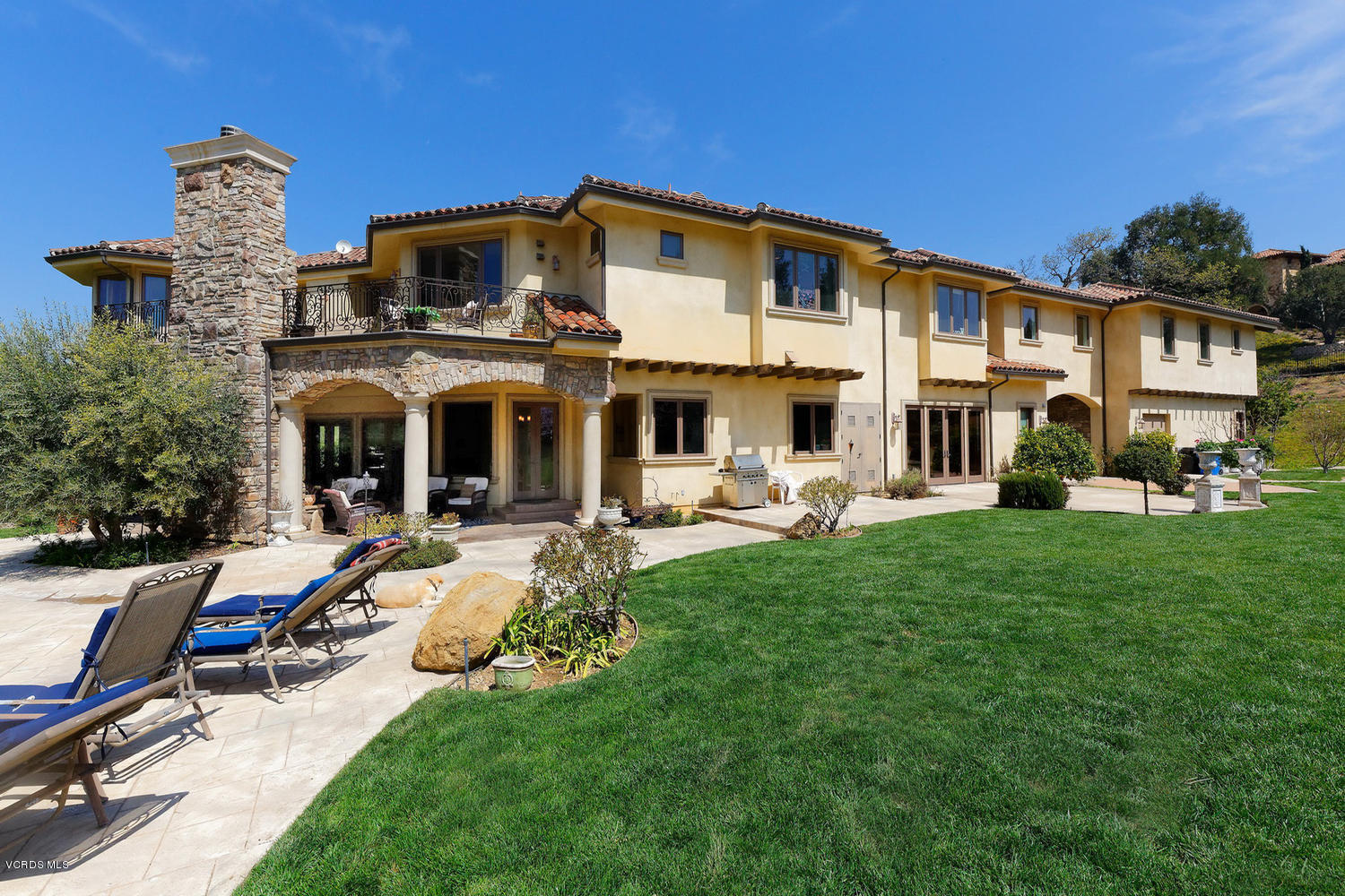 110 West Potrero Road Thousand Oaks, CA 91361 - Photo 24 of 33 a front view of a house with swimming pool having outdoor seating