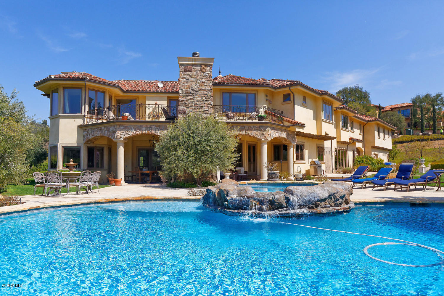 110 West Potrero Road Thousand Oaks, CA 91361 - Photo 28 of 33 a front view of a house with swimming pool having outdoor seating
