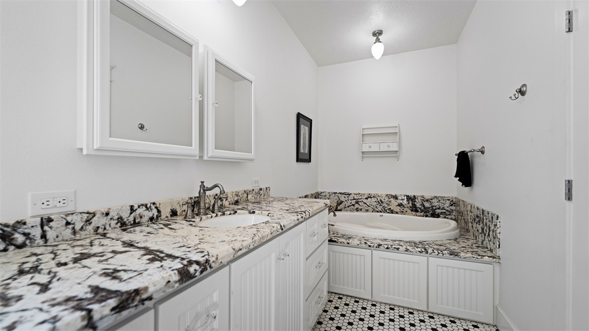 11258 Providence Road Hearne, TX 77859 - Photo 13 of 39 a bathroom with a sink and a mirror